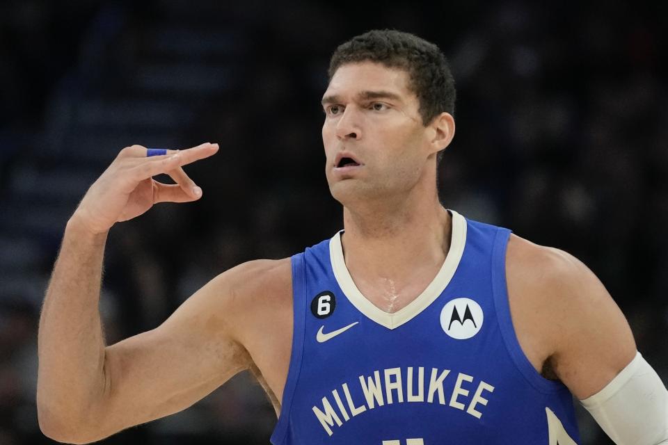 Milwaukee Bucks' Brook Lopez reacts after making a three-point basket during the first half of an NBA basketball game Wednesday, Nov. 16, 2022, in Milwaukee. (AP Photo/Morry Gash)