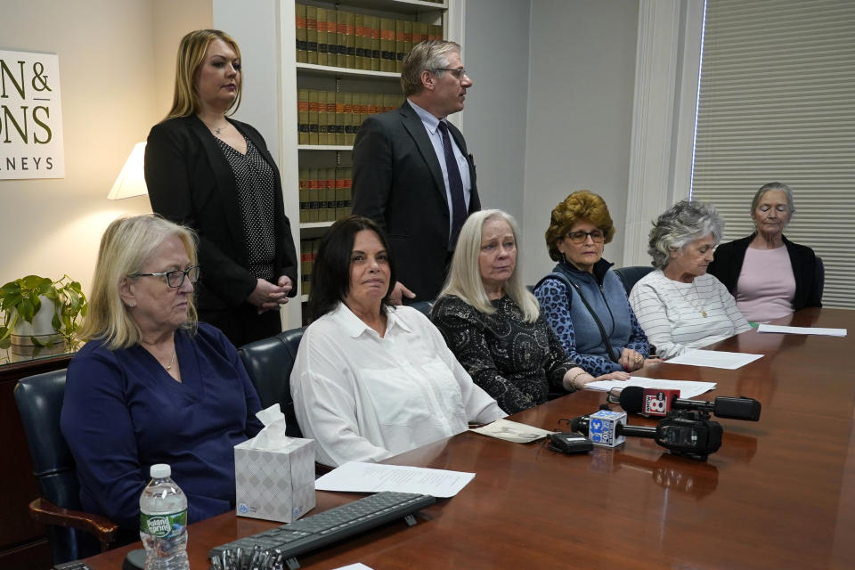 Several women seated next to Ann Allen, second from left, attend a news conference to announce they are joining Allen's lawsuit against the Roman Catholic Diocese of Portland, Wednesday, March 8, 2023, in Portland, Maine. A change in state law has removed the statute of limitations for sexual abuse cases. AP Photo/Robert F. Bukaty)