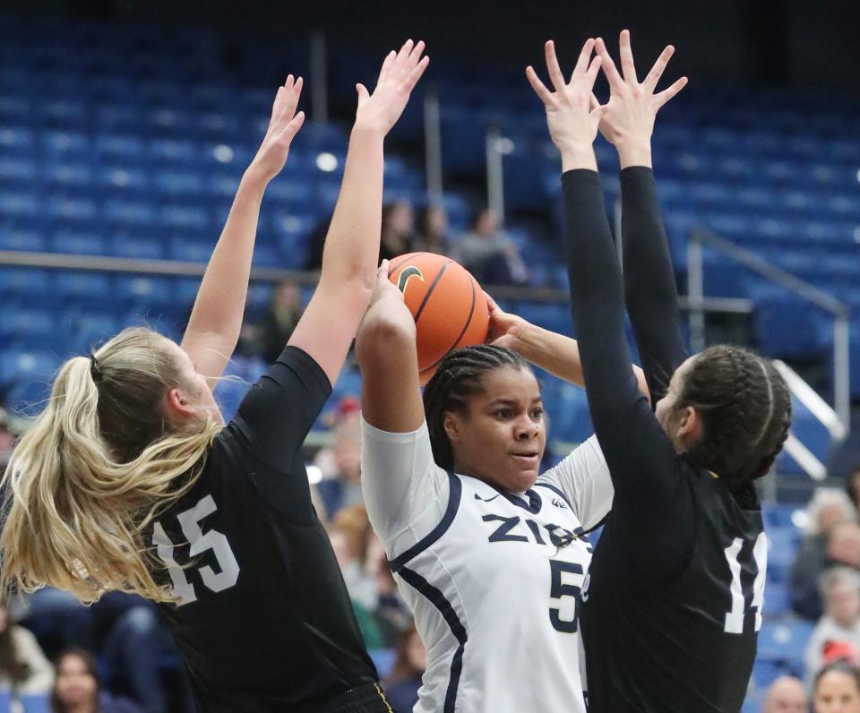 Kent State's Bridget Dunn and Katie Shumate double team Akron's Lanae Riley as she looks to pass in the first half, Saturday Jan. 20, 2024.