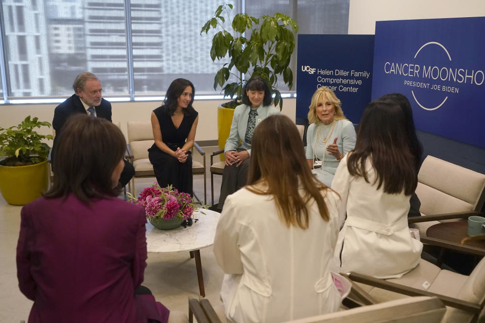 First lady Jill Biden, middle right, gestures while speaking with Dr. Alan Ashworth, clockwise from left, Dr. Paola Betancur, Dr. Monica Bertagnolli, Kami Pullakhandam, hidden, Dr. Rita Mukhtar, Dr. Laura Huppert and Rep. Jackie Speier, D-Calif., during a visit to the University of California San Francisco Helen Diller Family Comprehensive Cancer Center in San Francisco, Friday, Oct. 7, 2022. (AP Photo/Jeff Chiu, Pool)