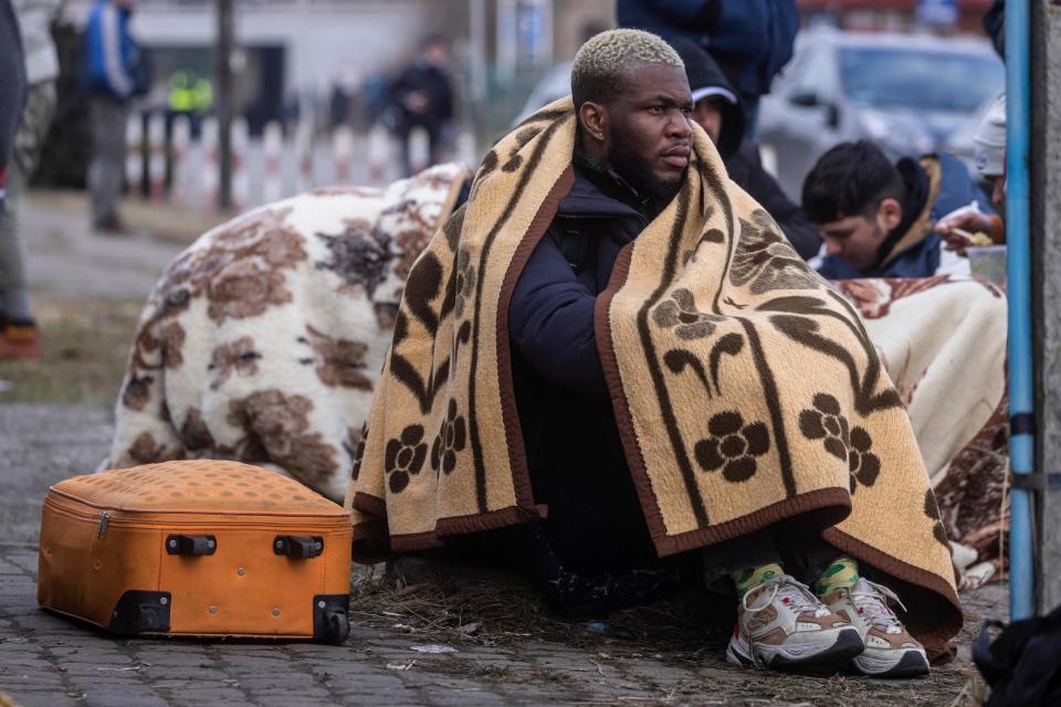 Refugees at a border crossing in eastern Poland