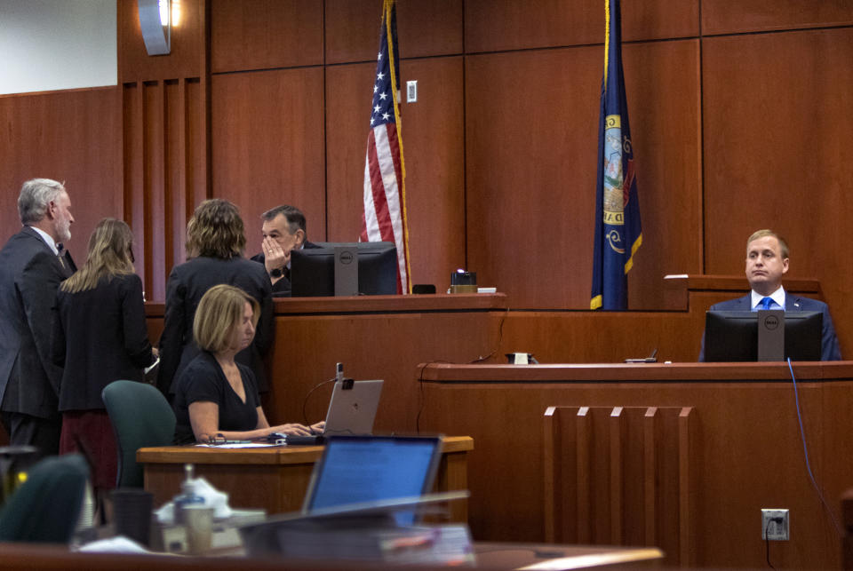 District Judge Michael Reardon confers with attorneys during the second day of testimony in the rape trial of former Idaho state Rep. Aaron von Ehlinger, right, at the Ada County Courthouse, Thursday, April 28, 2022, in Boise, Idaho. (Brian Myrick/The Idaho Press-Tribune via AP, Pool)