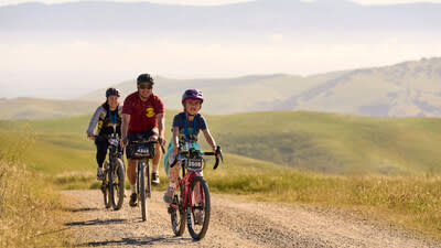 A family cycles together at the Life Time Sea Otter Classic.