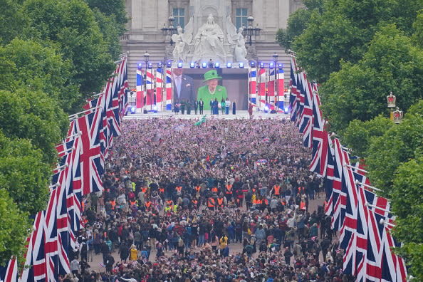 <div class="inline-image__caption"><p>Crowds are seen on The Mall with Queen Elizabeth II shown on a screen during the singing of the National Anthem at the Platinum Jubilee Pageant in front of Buckingham Palace, London, on day four of the Platinum Jubilee celebrations.</p></div> <div class="inline-image__credit">Dominic Lipinski/PA Images via Getty Images</div>