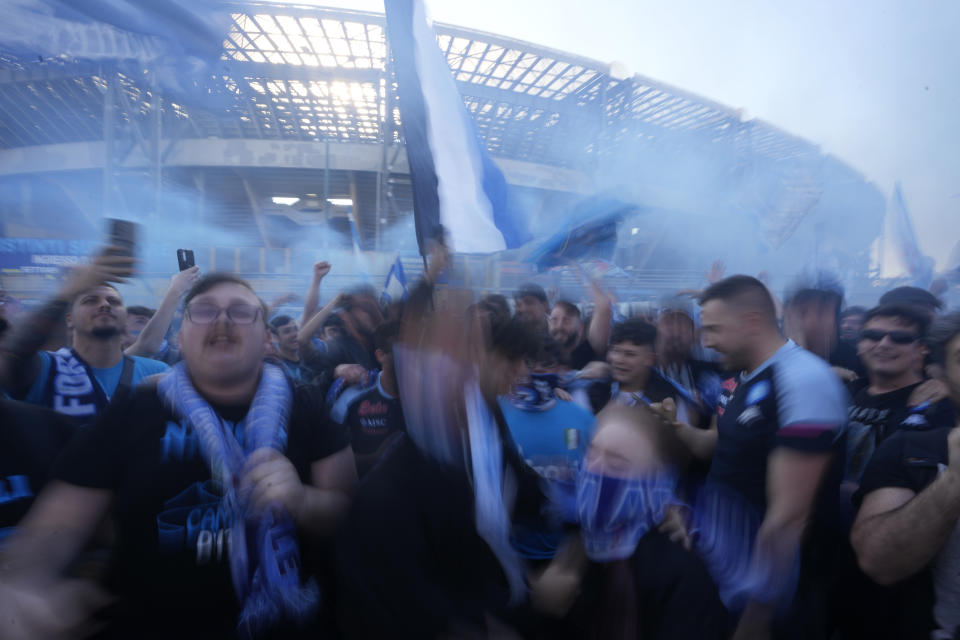 Napoli fans cheer in front of the Diego Armando Maradona stadium, in Naples, Italy, Thursday, May 4, 2023. (AP Photo/Andrew Medichini)