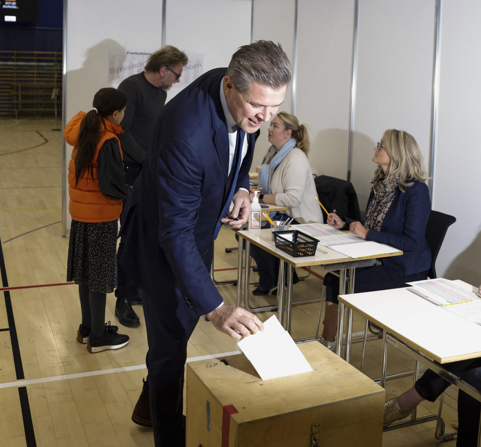 Independent Party candidate Bjarni Benediktsson casts his ballot at a polling station, in Gardabae, Iceland, Saturday, Sept. 25, 2021. Icelanders are voting in a general election dominated by climate change, with an unprecedented number of political parties likely to win parliamentary seats. Polls suggest there won’t be an outright winner on Saturday, triggering complex negotiations to build a coalition government. (AP Photo/Brynjar Gunnarsson)