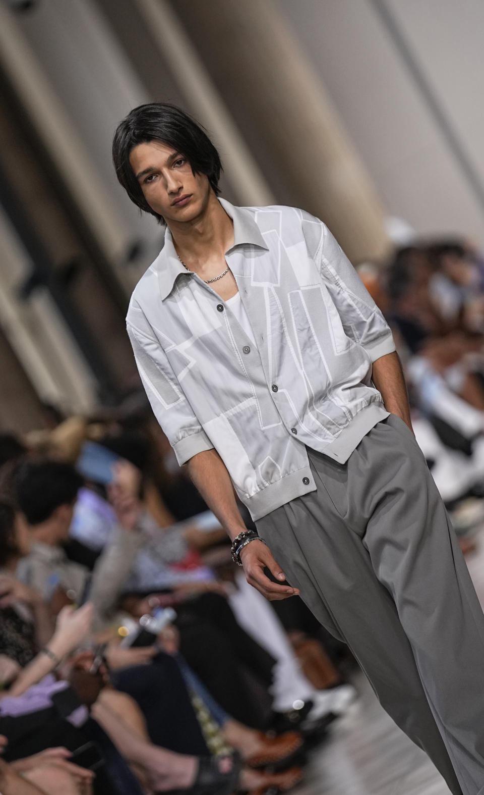 A model wears a creation for the Hermes Menswear Spring/Summer 2024 fashion collection presented in Paris, Saturday, June 24, 2023. (AP Photo/Michel Euler)