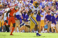 LSU running back Tyrion Davis-Price (3) scores a touchdown against Florida in the second half of an NCAA college football game in Baton Rouge, La., Saturday, Oct. 16, 2021. (AP Photo/Matthew Hinton)