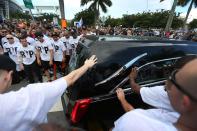 <p>Miami Marlins players and members of the Marlins organization and their fans watch as the hearse carrying Miami Marlins pitcher Jose Fernandez passes by as they to pay their respects on September 28, 2016 in Miami, Florida. Mr. Fernandez was killed in a weekend boat crash in Miami Beach along with two friends. (Photo by Joe Raedle/Getty Images) </p>