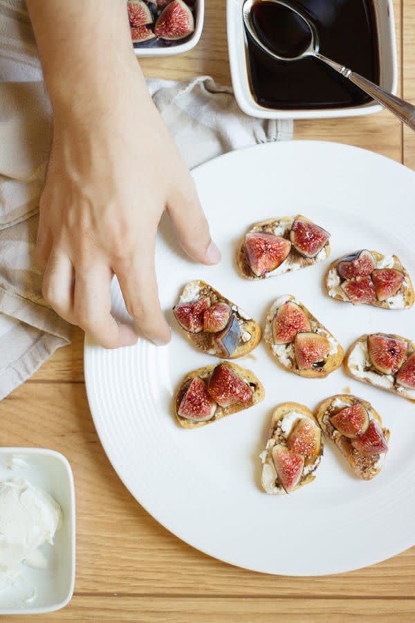 <p>Fresh figs, balsamic vinegar, goat cheese and olive oil come together on baguette slices to make an instant crowd-pleaser. </p><p><em><a href="https://lovelyindeed.com/balsamic-fig-and-goat-cheese-crostini/" rel="nofollow noopener" target="_blank" data-ylk="slk:Get the recipe from Lovely Indeed »;elm:context_link;itc:0;sec:content-canvas" class="link ">Get the recipe from Lovely Indeed »</a></em><br></p>