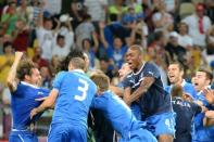 Italian players celebrate after winning the Euro 2012 quarter-final match against England on June 24. Italy advanced to the semi-finals of Euro 2012 with victory in a shoot-out after a quarter-final duel finished 0-0 following extra-time