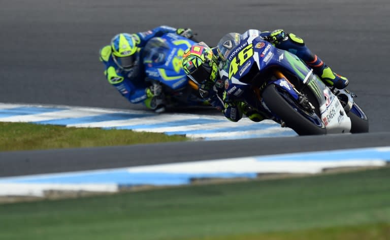 Movistar Yamaha's Valentino Rossi (R) extends his lead over third placed teammate Jorge Lorenzo to 24 points with his second place in Australia on October 23, 2016