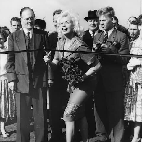 Actress Jayne Mansfield cutting the tape to open the new Chiswick fly-over road, England, September 30th 1959. (Photo by Central Press/Hulton Archive/Getty Images) - Credit: Central Press/Hulton Archive/Getty Images