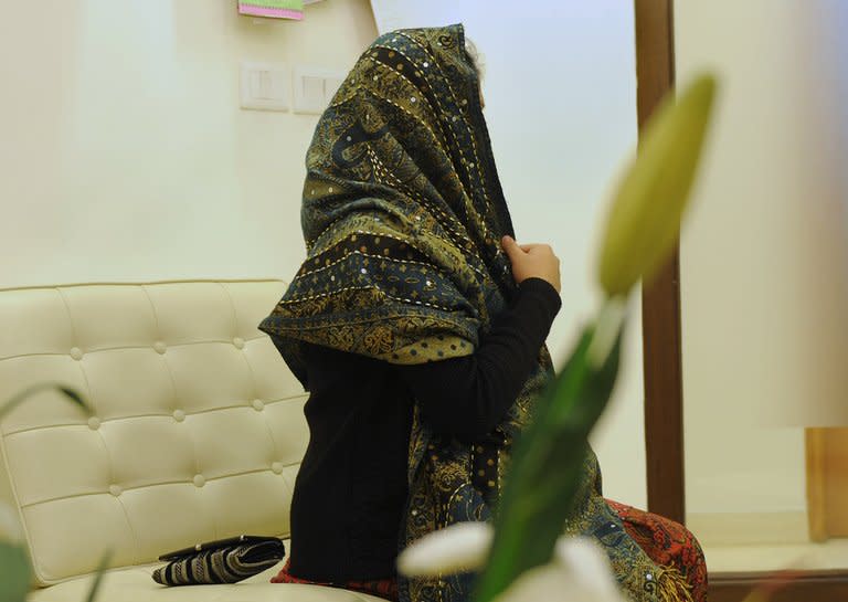 An Indian surrogate mother sits at the Surrogacy Centre India (SCI) clinic in New Delhi on February 5, 2013. Commercial surrogacy is a booming industry in India with legions of childless foreign couples looking for a low-cost, legally simple route to parenthood