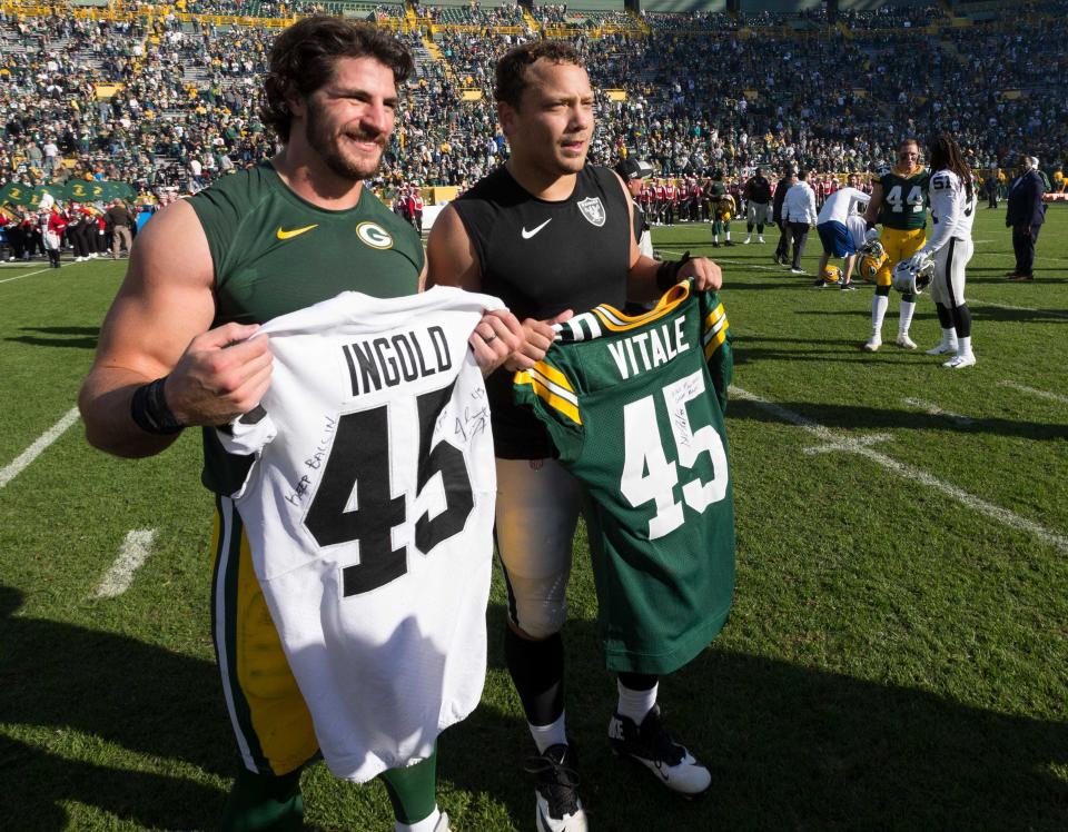 Packers fullback Danny Vitale, left, and Raiders fullback Alec Ingold exchange jerseys after their Oct. 20, 2019, game at Lambeau Field, Green Bay, Wis. Ingold, a graduate of Bay Port High School in Howard, Wis., is now with the Miami Dolphins. Vitale retired in 2021.