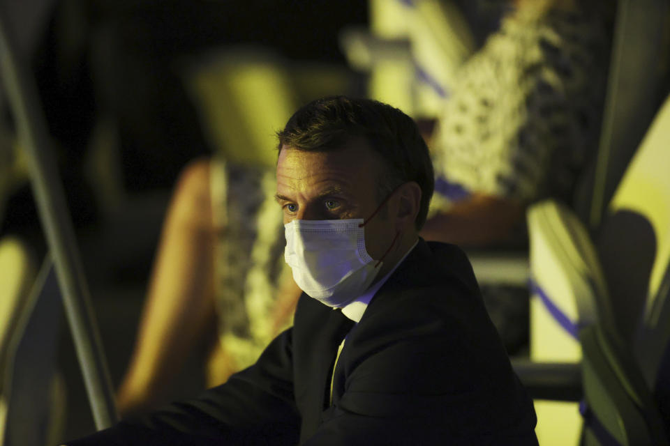 French President Emmanuel Macron watches the opening ceremony in the Olympic Stadium at the 2020 Summer Olympics, Friday, July 23, 2021, in Tokyo, Japan. (Leon Neal/Pool Photo via AP)