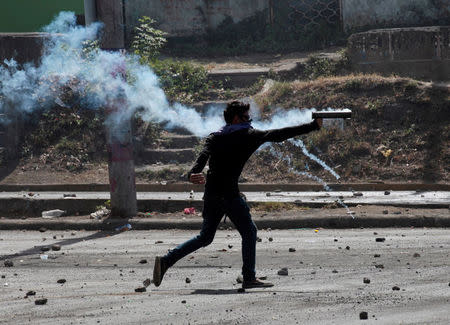 A demonstrator fires a homemade mortar towards riot police during a protest over a controversial reform to the pension plans of the Nicaraguan Social Security Institute (INSS) in Managua, Nicaragua April 21, 2018. REUTERS/Oswaldo Rivas