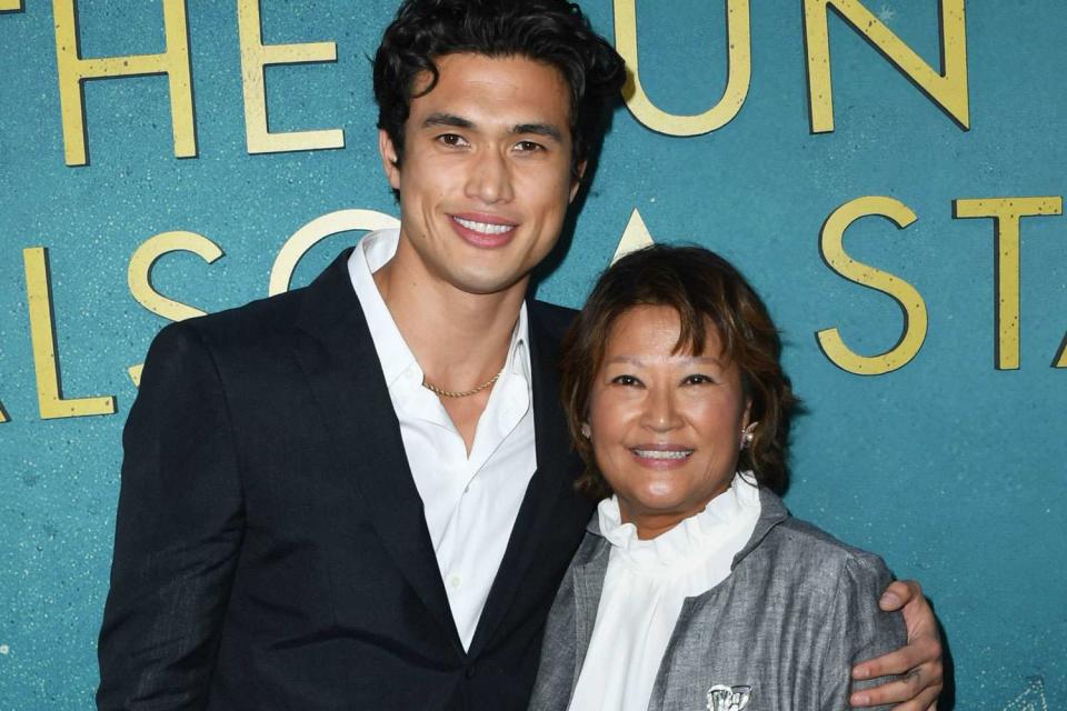 <p>Jon Kopaloff/Getty</p> Charles Melton and mom Sukyong Melton attend the world premiere Of Warner Bros "The Sun Is Also A Star
