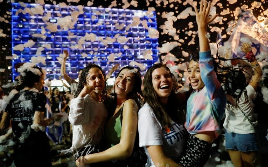 Celebrations in Rabin Square, Tel Aviv, last night - CORINNA KERN/REUTERS