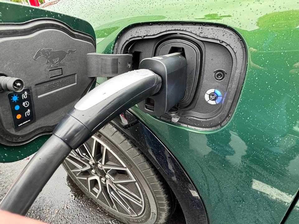 2024 Ford Mustang Mach-E electric vehicle charging at a Seattle-area Tesla DC charger.