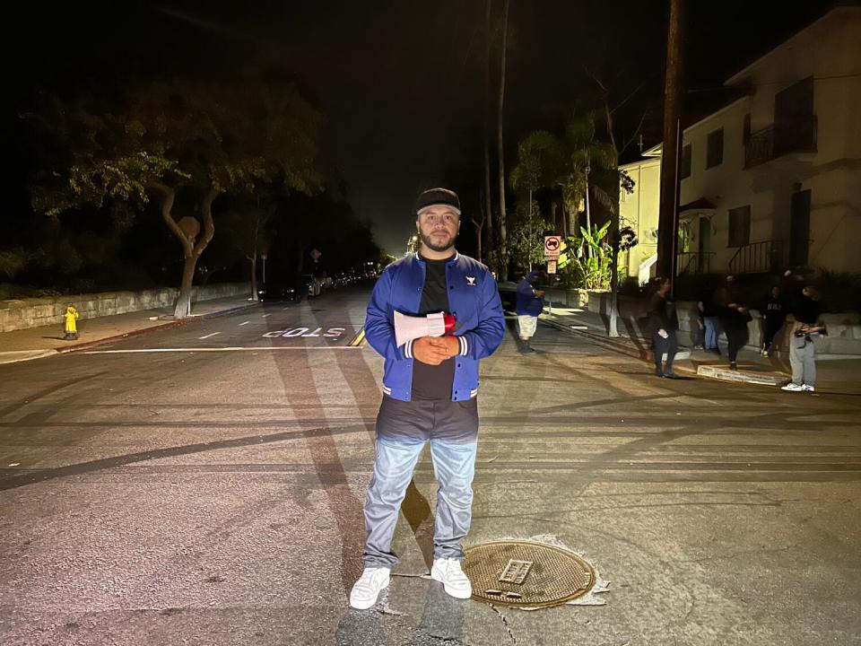 Activist Edin Alex Enamorado stands at an empty Santa Barbara intersection