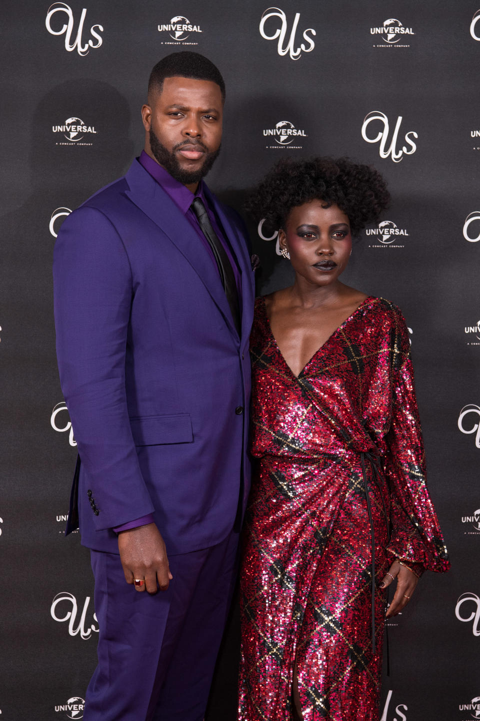 Winston Duke and Lupita Nyong'o poses at a 2019 "Us" screening in London, England