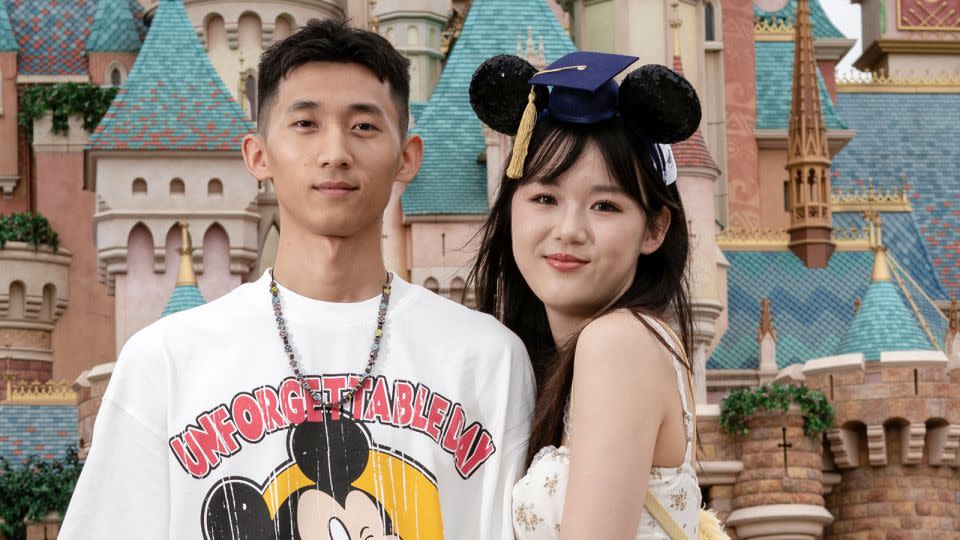 Jing Hongche, 23, and his girlfriend Li Sitan, 22,<strong> </strong>are at Disneyland celebrating Li's graduation from college. Disney stuffed animals wearing caps and gowns, and bouquets of soft toys are popular gifts to graduates. - Noemi Cassanelli/CNN