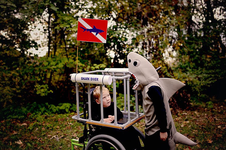 <p>Just when you thought it was safe to go back in the water, here comes a shark diver with a sibling shark! (It sure beats another round of <a href="https://www.goodhousekeeping.com/holidays/halloween-ideas/g28367776/baby-shark-halloween-costume/" rel="nofollow noopener" target="_blank" data-ylk="slk:Baby Shark costumes;elm:context_link;itc:0;sec:content-canvas" class="link ">Baby Shark costumes</a>.)</p><p><a href="https://www.sarahhalstead.com/shark-diver-wheelchair-costume/" rel="nofollow noopener" target="_blank" data-ylk="slk:See more at Sarah Halstead »;elm:context_link;itc:0;sec:content-canvas" class="link "><em>See more at Sarah Halstead »</em></a></p>