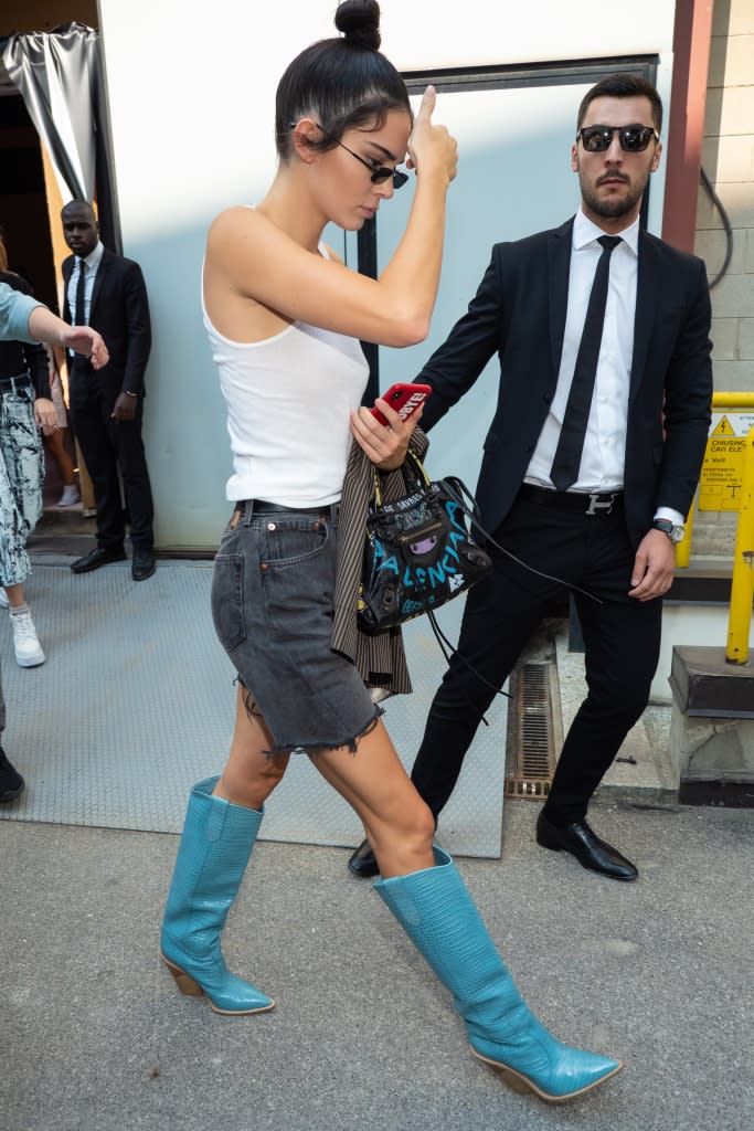 Kendall Jenner exiting the Fendi spring ’19 show on Sept. 20, 2018 in bold teal Western boots by the Italian label. - Credit: Splash