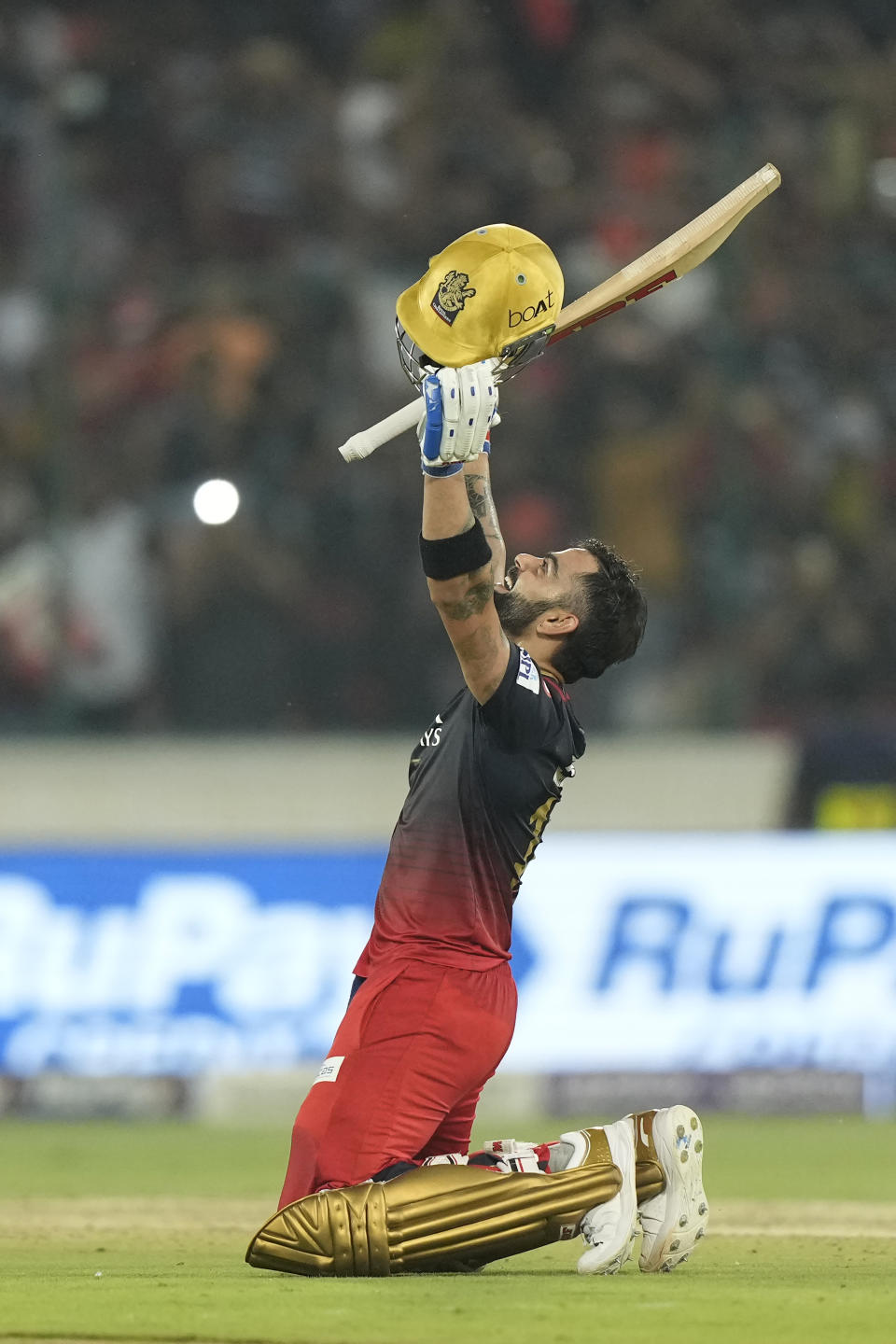 Royal Challengers Bangalores' Virat Kohli celebrates scoring a century during the Indian Premier League cricket match between Sunrisers Hyderabad and Royal Challengers Bangalore in Hyderabad, India, Thursday, May 18, 2023. (AP Photo/Mahesh Kumar A.)