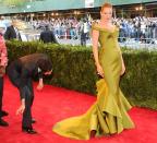 Designer Zac Posen, left, fixes the dress of actress Uma Thurman as they attend The Metropolitan Museum of Art's Costume Institute benefit celebrating "PUNK: Chaos to Couture" on Monday, May 6, 2013 in New York. (Photo by Evan Agostini/Invision/AP)