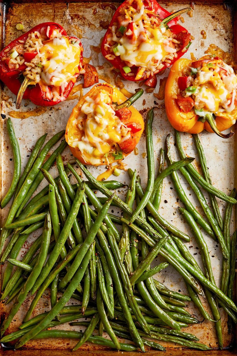 Stuffed peppers? Yes please! Spicy Cajun seasoning and chicken andouille sausage give these stuffed peppers some kick, and green beans roast on the same pan for an easy side.