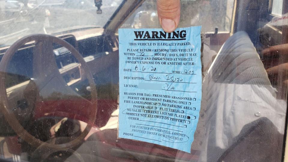 <p>This is how plenty of cars end up in a place like this: angry apartment manager had it towed away after it sat with years-expired tags for too long. </p>