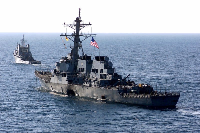 The U.S. Navy destroyer USS Cole is towed away from the port city of Aden, Yemen, into open sea by the Military Sealift Command ocean-going tug USNS Catawba. On October 12, 2000, 17 sailors were killed and 39 injured in an explosion on the USS Cole as it refueled in Yemen. File Photo by Don L. Maes/U.S. Navy