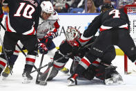 Washington Capitals left wing Alex Ovechkin (8) is stopped by Buffalo Sabres goaltender Ukko-Pekka Luukkonen (1) during the second period of an NHL hockey game Tuesday, April 2, 2024, in Buffalo, N.Y. (AP Photo/Jeffrey T. Barnes)