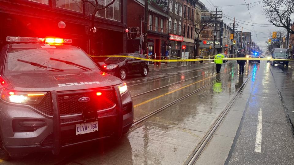 Police say one person is dead after a triple shooting near Queen Street W. and Portland Street early Thursday morning. (Paul Smith/CBC - image credit)