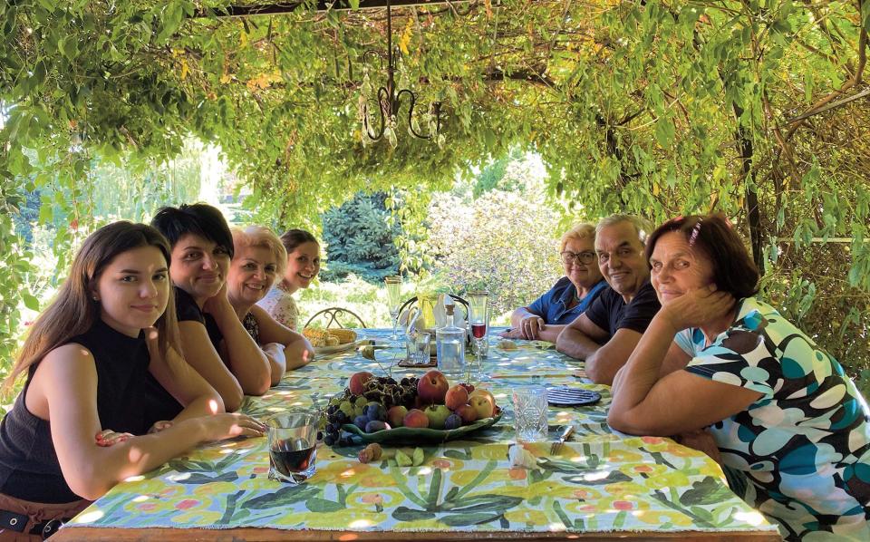 Hercules (back left) with family in Kakhovka last August, including her mother (to Olia’s right) - Courtesy of Olia Hercules 