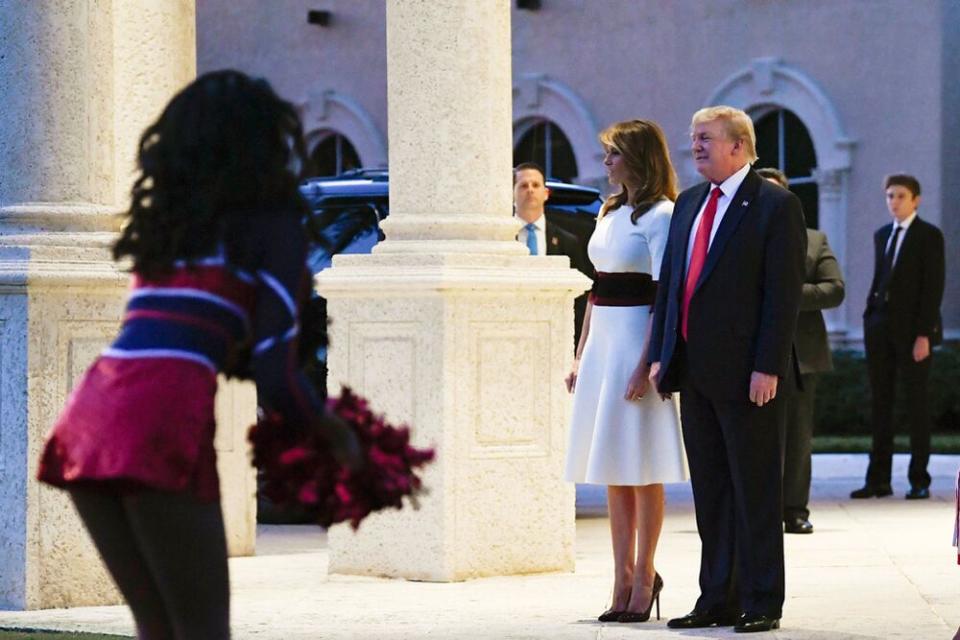 From left: First Lady Melania Trump and President Donald Trump with their son, Barron, at Trump International Golf Club in West Palm Beach, Florida. | Susan Walsh/AP/Shutterstock