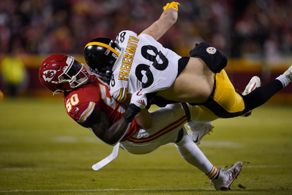 Pittsburgh Steelers tight end Pat Freiermuth (88) is tackled by Kansas City Chiefs middle linebacker Willie Gay Jr. (50) during the first half of an NFL wild-card playoff football game, Sunday, Jan. 16, 2022, in Kansas City, Mo. (AP Photo/Ed Zurga)
