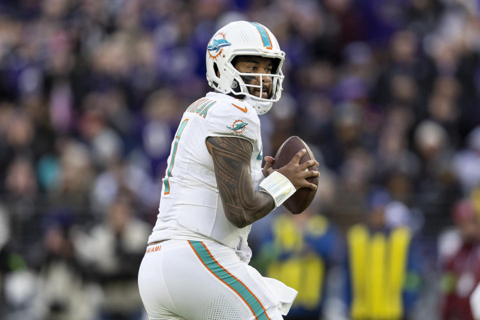 BALTIMORE, MARYLAND - DECEMBER 31: Tua Tagovailoa #1 of the Miami Dolphins drops back and looks to pass during an NFL football game between the Baltimore Ravens and the Miami Dolphins at M&T Bank Stadium on December 31, 2023 in Baltimore, Maryland. (Photo by Michael Owens/Getty Images)