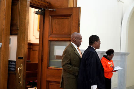 Actor and comedian Bill Cosby exits with his publicist Andrew Wyatt, during Cosby's sexual assault retrial at the Montgomery County Courthouse in Norristown, Pennsylvania, U.S. April 23, 2018. REUTERS/Jessica Kourkounis