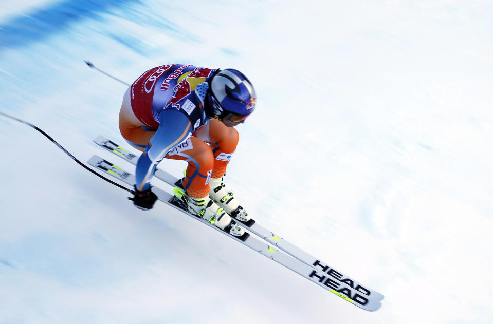 Aksel Lund Svindal of Norway is airborne as he speeds down the course during an alpine ski men's World Cup downhill training in Kitzbuehel, Austria, Thursday, Jan. 23, 2014. (AP Photo/Shinichiro Tanaka)