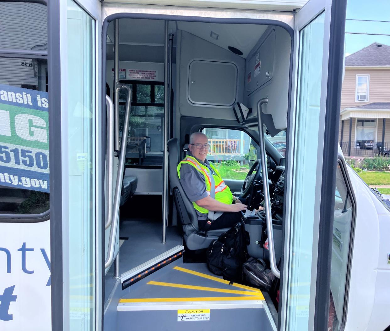 Licking County Transit driver Dennis Combs stops at the Day Avenue stop along the Main Street route on Monday, the first day of a deviated fixed-route service from Heritage Hail on East Main Street to Tamarack Road on West Main Street.