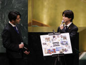 ADDS IDS - Members of South Korean K-pop band BTS Jung Kook, left, and Jimin appear at the United Nations meeting on Sustainable Development Goals during the 76th session of the U.N. General Assembly at U.N. headquarters on Monday, Sept. 20, 2021. (John Angelillo/Pool Photo via AP)