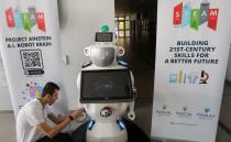 High school student Konstantinos Timinis works on "Alnstein", a robot powered with ChatGPT, in Pascal school in Nicosia