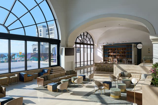 <p>Courtesy of Marriott Cancun, an All-Inclusive Resort</p> Interior of the Greatroom, including lounge area and bar at the Marriott Cancun, an All-Inclusive Resort