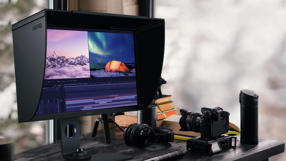 BenQ SW321C PhotoVue, one of the best monitors for MacBook Pro, on a desk surrounded by photo equipment