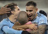 Minnesota United's Franco Fragapane, right, celebrates with teammates after scoring the go-ahead goal against the Philadelphia Union in an MLS soccer match Wednesday, Oct. 20, 2021, in St. Paul, Minn. (Carlos Gonzalez/Star Tribune via AP)