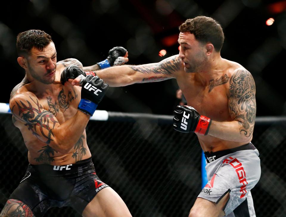 Frankie Edgar (red gloves) fights Cub Swanson (blue gloves) during UFC Fight Night at Atlantic City Boardwalk Hall. Mandatory Credit: Noah K. Murray-USA TODAY Sports