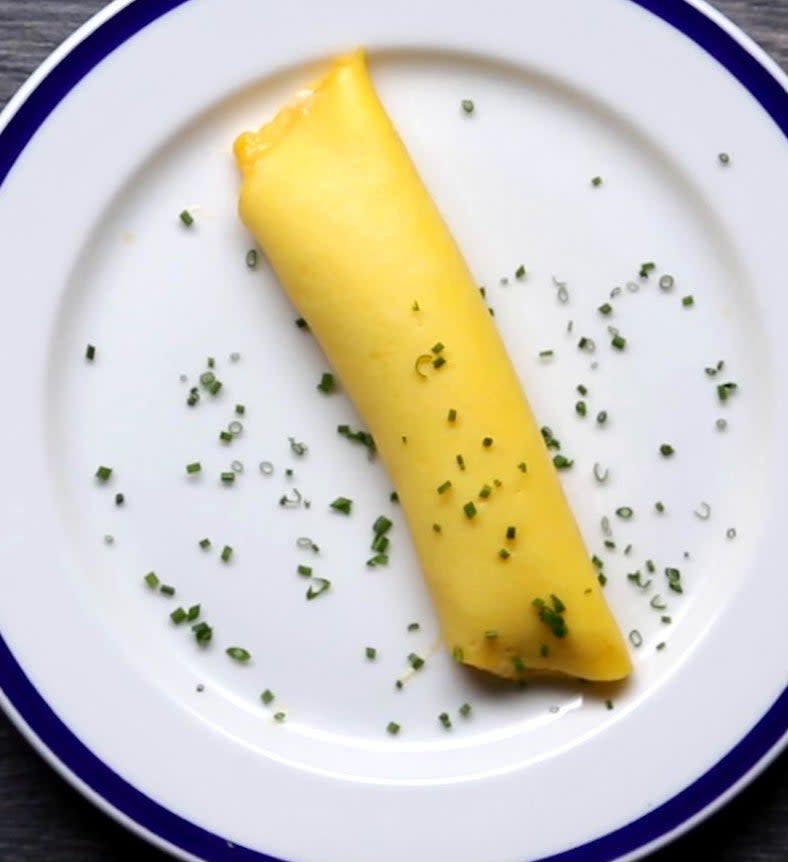 A French omelette topped with chives.